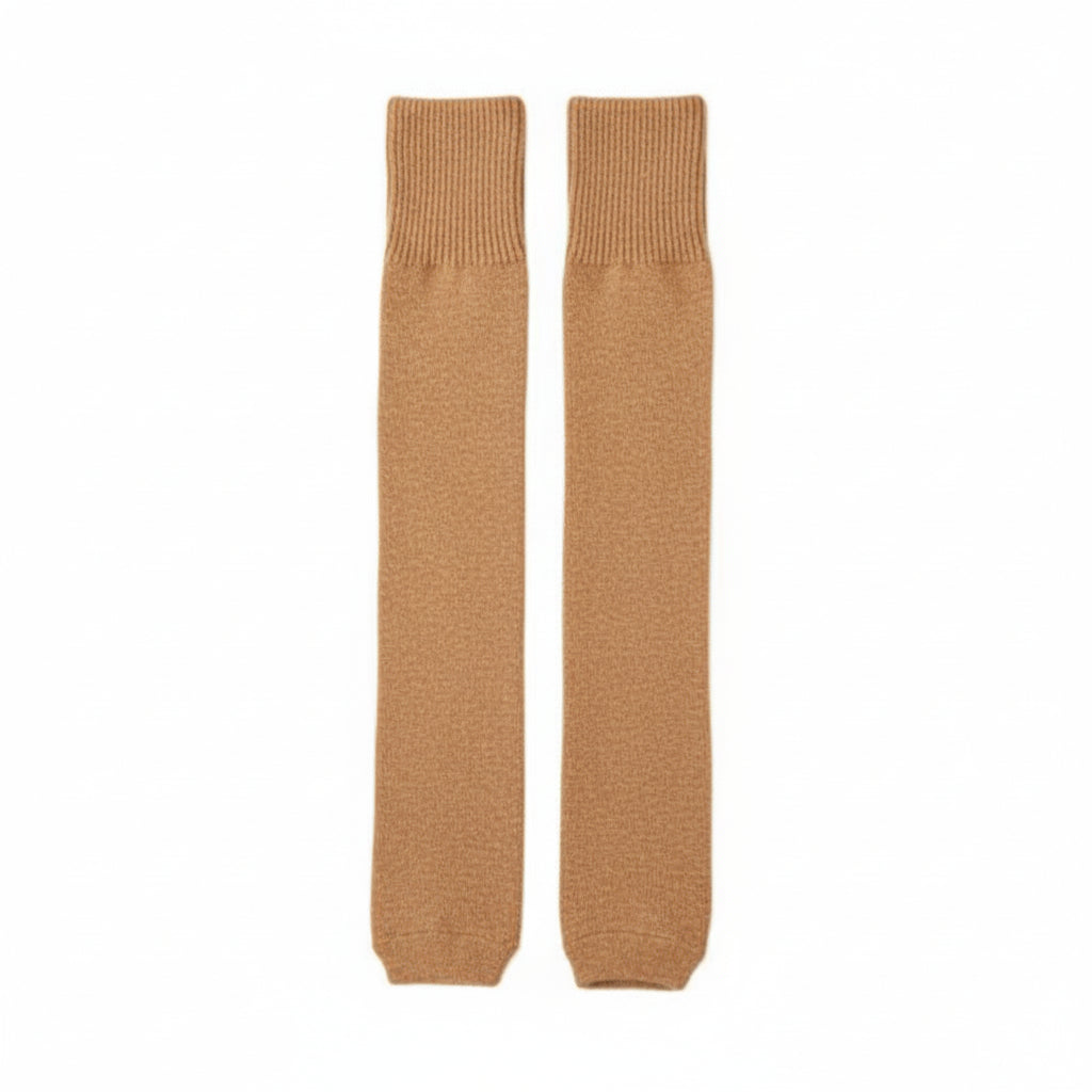 Pair of beige knee-high leg warmers on a white background