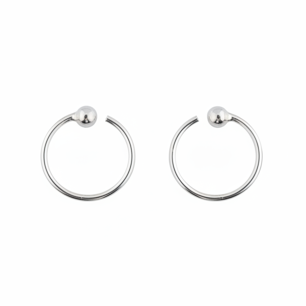 Pair of silver hoop earrings on a white background