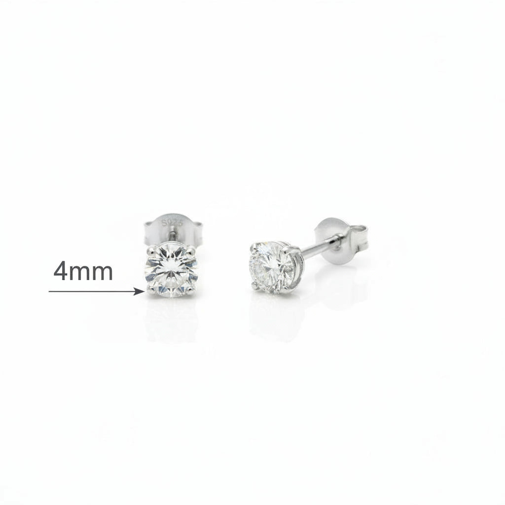 Pair of silver stud earrings with clear gemstones on a white background